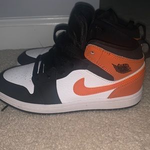 Orange, black & White Air Jordan’s